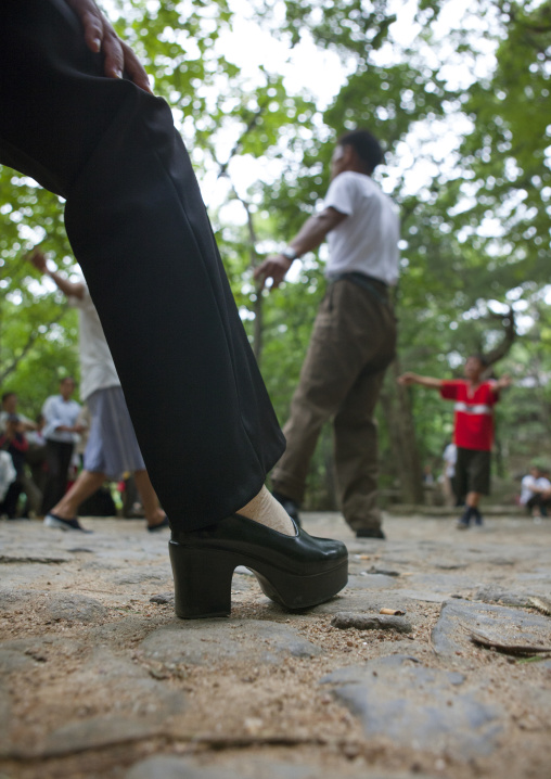 North Korean electricity company workers dancing in a park, North Hwanghae Province, Kaesong, North Korea