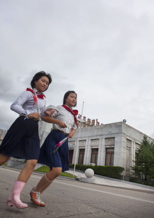 North Korean pioneers going to pay respect to the Dear Leaders at Mansudae art studio, Pyongan Province, Pyongyang, North Korea