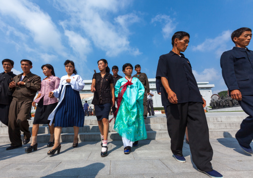 North Korean people in front of the statues of the Dear Leaders in Mansudae Grand monument, Pyongan Province, Pyongyang, North Korea