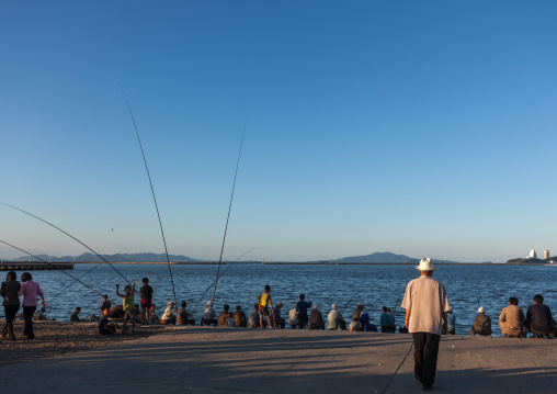 North Korean men fishing in the port, Kangwon Province, Wonsan, North Korea