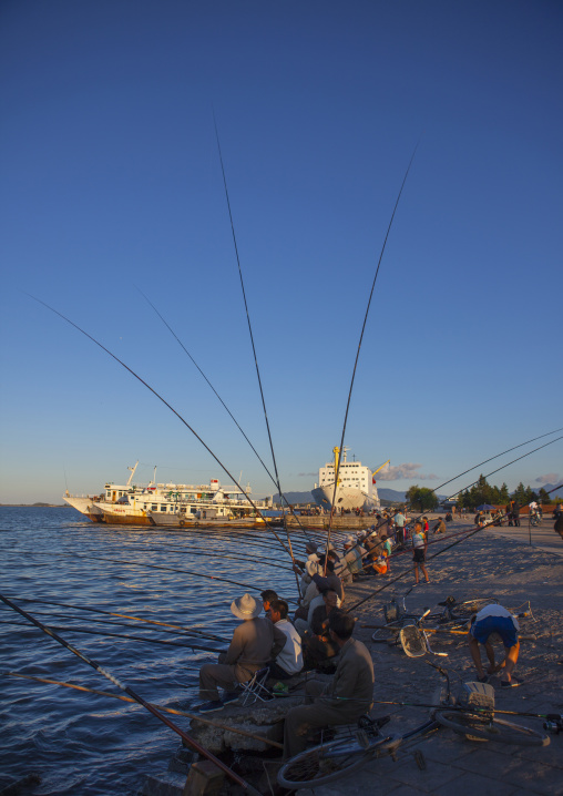 North Korean men fishing in the port, Kangwon Province, Wonsan, North Korea