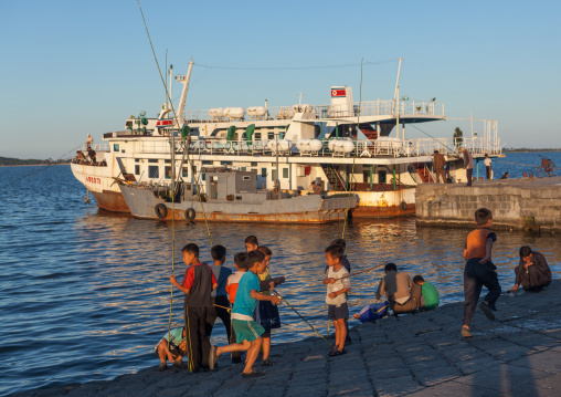 North Korean men fishing in the port, Kangwon Province, Wonsan, North Korea