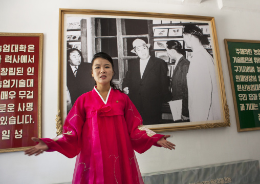 North Korean guide in red choson-ot dress in the agriculture university, South Hamgyong Province, Hamhung, North Korea