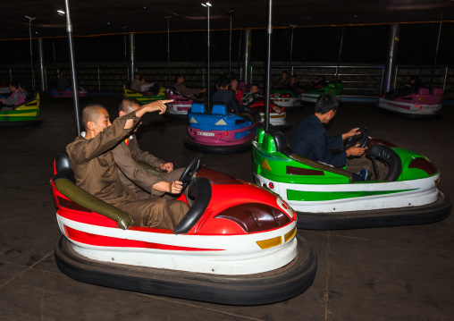 North Korean people having fun in bumper cars at Kaeson youth park, Pyongan Province, Pyongyang, North Korea