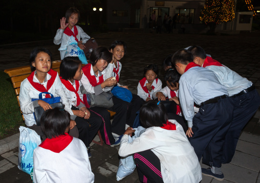 North Korean pioneers in Kaeson youth park at night, Pyongan Province, Pyongyang, North Korea