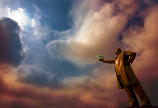 Kim il Sung statue holding a radioactive football ball the Grand monument on Mansu hill, Pyongan Province, Pyongyang, North Korea