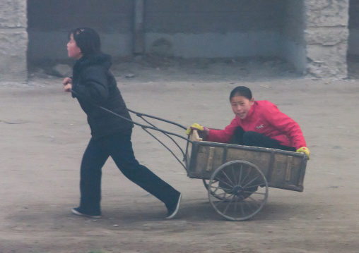 North Korean people pushing cart, North Hamgyong Province, Chongjin, North Korea