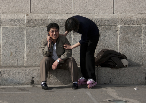 North Korean teenagers speaking on a mobile phone, Pyongan Province, Pyongyang, North Korea