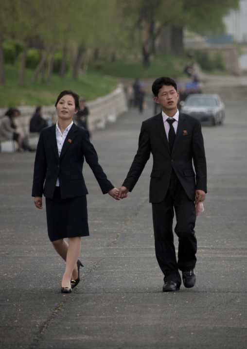 North Korean couple inlove walking hand in hand in the street, Pyongan Province, Pyongyang, North Korea