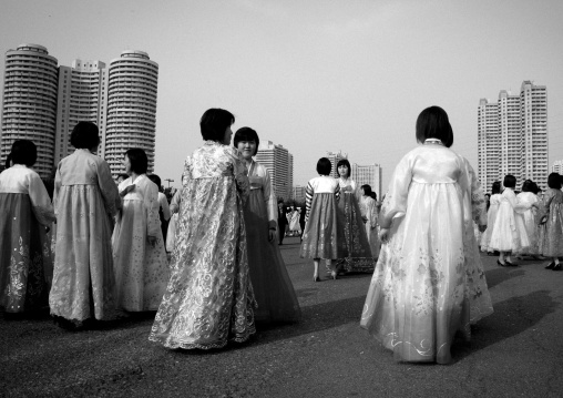 North Korean young adults during a mass dance performance in front of buildings on military foundation day, Pyongan Province, Pyongyang, North Korea