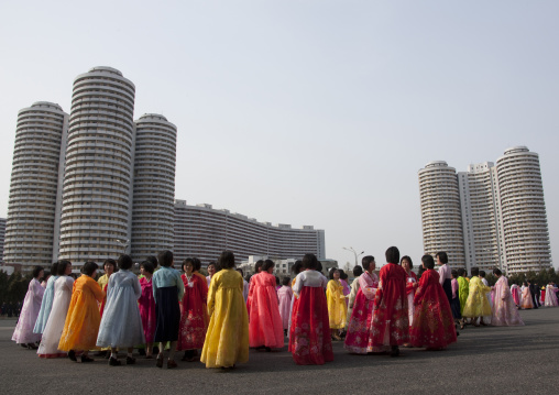 North Korean young adults during a mass dance performance in front of buildings on military foundation day, Pyongan Province, Pyongyang, North Korea