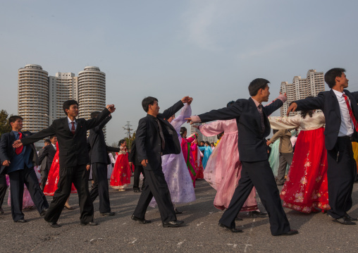 North Korean young adults during a mass dance performance in front of buildings on military foundation day, Pyongan Province, Pyongyang, North Korea