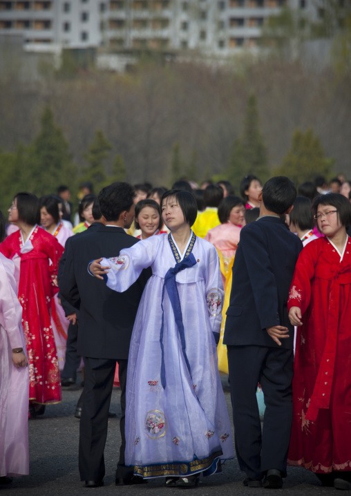 North Korean young adults during a mass dance performance in front of buildings on military foundation day, Pyongan Province, Pyongyang, North Korea