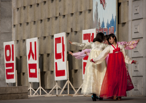 North Korean young adults during a mass dance performance in front of buildings on military foundation day, Pyongan Province, Pyongyang, North Korea