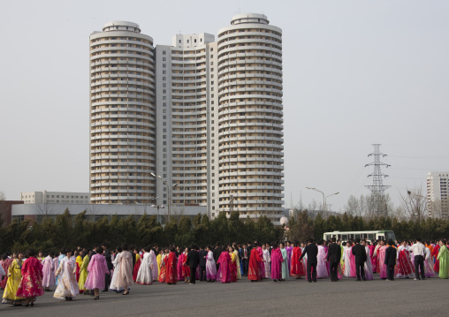 North Korean young adults during a mass dance performance in front of buildings on military foundation day, Pyongan Province, Pyongyang, North Korea