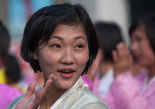 North Korean young adults during a mass dance performance in front of buildings on military foundation day, Pyongan Province, Pyongyang, North Korea