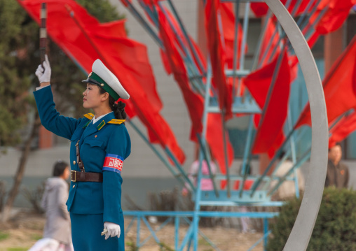 North Korean traffic security officer in blue uniform in the street, Pyongan Province, Pyongyang, North Korea