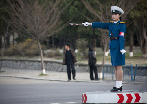 North Korean traffic security officer in blue uniform in the street, Pyongan Province, Pyongyang, North Korea