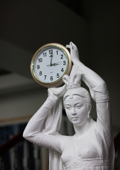 Statue of a woman holding a clock, Pyongan Province, Pyongyang, North Korea