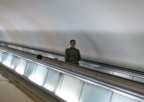 North Korean people using escalator leading to the subway station, Pyongan Province, Pyongyang, North Korea