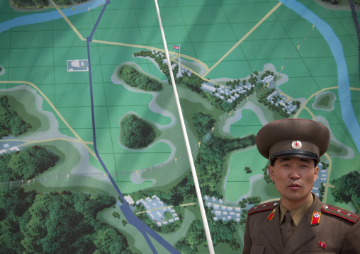 North Korean soldier in the joint security area in front of the map of the Demilitarized Zone, North Hwanghae Province, Panmunjom, North Korea