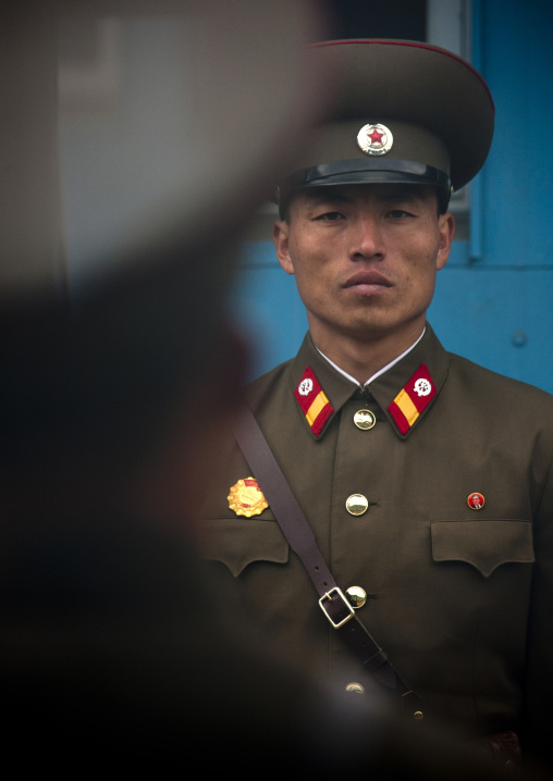 North Korean soldiers standing in front of the United Nations conference rooms on the demarcation line in the Demilitarized Zone, North Hwanghae Province, Panmunjom, North Korea