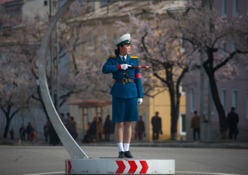 North Korean traffic security officer in blue uniform in the street, Pyongan Province, Pyongyang, North Korea