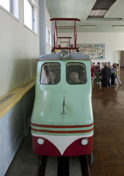 North Korean children having fun in a fake locomotive at Kwangbok primary school, Pyongan Province, Pyongyang, North Korea