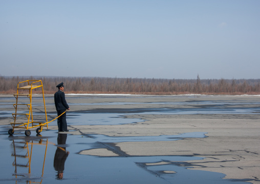 North Korean airport employee waiting an air Koryo plane, Ryanggang Province, Samjiyon, North Korea