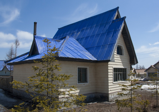 New apartment houses with blue roof in the countryside, Ryanggang Province, Samjiyon, North Korea