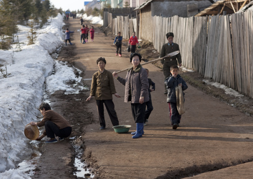 North Korean women using melted snow as washing water, Ryanggang Province, Samjiyon, North Korea