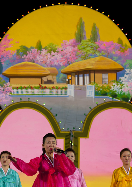 North Korean singers during a mass dance to celebrate april 15 the birth anniversary of Kim Il-sung on Kim il Sung square, Pyongan Province, Pyongyang, North Korea