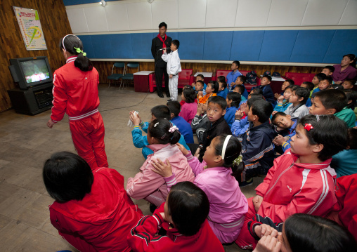 North Korean children singing during a karaoke Songdowon international children's camp, Kangwon Province, Wonsan, North Korea