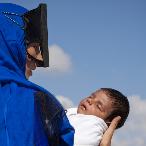 Profile Of A Bedouin Masked Woman Holing Her New Borned Baby, Sinaw, Oman