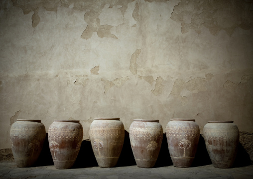 A Row Of Jabrin Pot With Painting Decoration Of Palm Trees, Oman