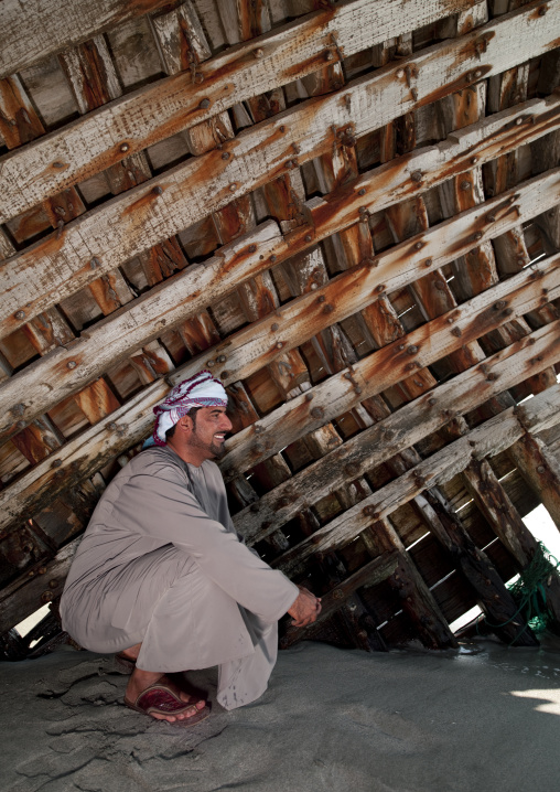 Man Sitting Next To A Dhow, Masirah Island, Oman