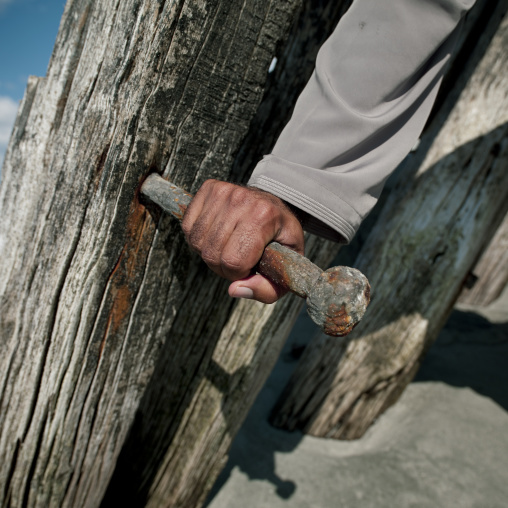 A Hand Holing A Big Nail In Dhow, Masirah Island , Oman