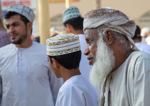 Omani men in the cattle market, Ad Dakhiliyah Region, Nizwa, Oman