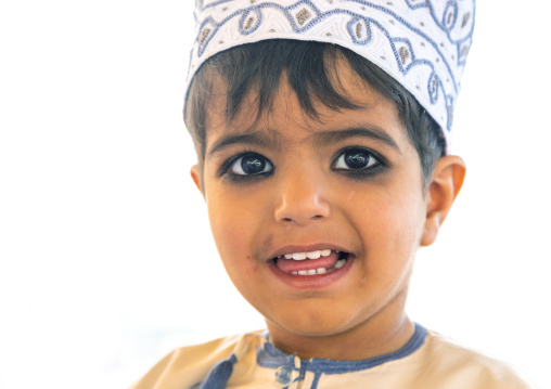 Omani boy in traditional clothing with kohl on his eyes, Ad Dakhiliyah Region, Nizwa, Oman