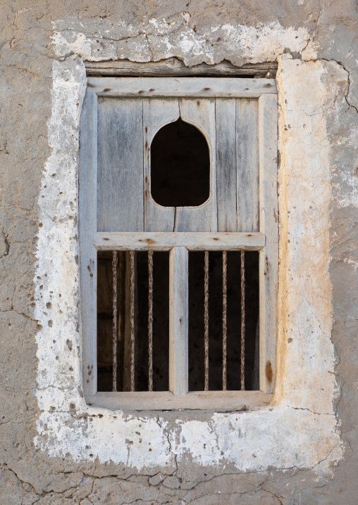 Wooden carved window of an abandoned house, Dhofar Governorate, Mirbat, Oman