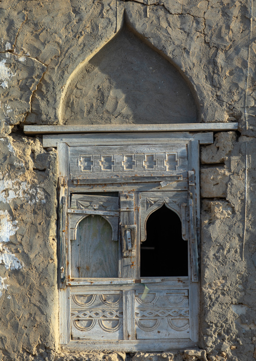 Wooden carved window of an abandoned house, Dhofar Governorate, Mirbat, Oman