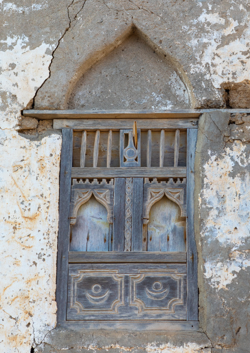 Wooden carved window of an abandoned house, Dhofar Governorate, Mirbat, Oman