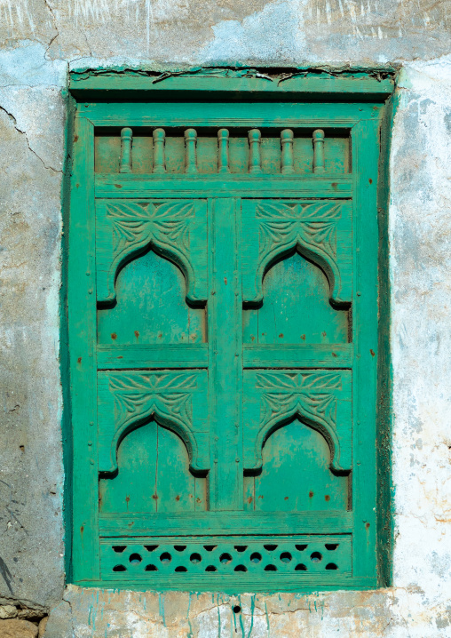 Wooden carved window of an abandoned house, Dhofar Governorate, Mirbat, Oman