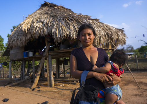 Panama, Darien Province, Alto Playona, Woman Of The Native Indian Embera Tribe With Her Baby