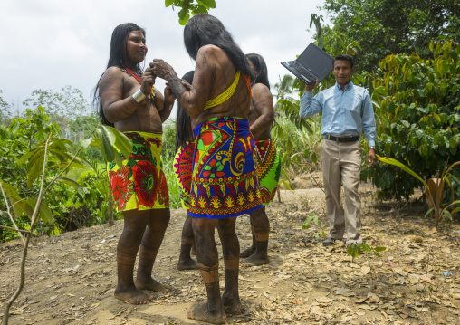 Panama, Darien Province, Bajo Chiquito, Embera Indians In Traditional Clothing Dancing On The Sound Of A Computer