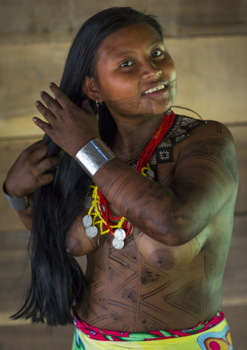 Panama, Darien Province, Bajo Chiquito, Woman Of The Native Indian Embera Tribe Combing Hair