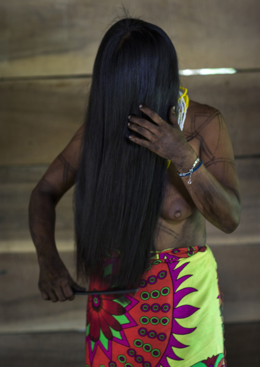 Panama, Darien Province, Bajo Chiquito, Woman Of The Native Indian Embera Tribe Combing Hair