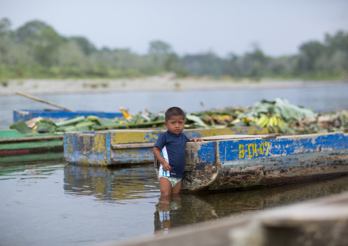 Panama, Darien Province, Bajo Chiquito, Embera Tribe Child Dressed In Western Clothes In A River