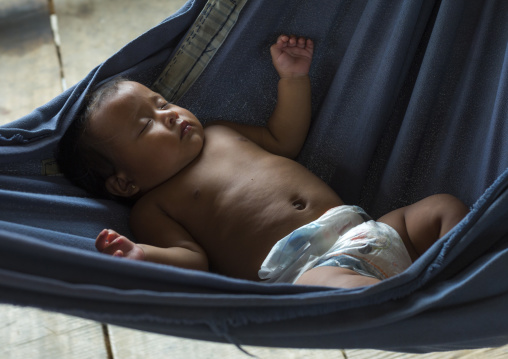 Panama, Darien Province, Bajo Chiquito, Embera Tribe Baby Sleeping In A Hammock