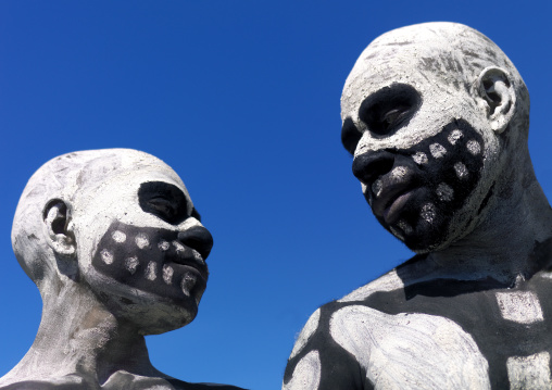 Skeleton tribe men during a sing-sing against blue sky, Western Highlands Province, Mount Hagen, Papua New Guinea